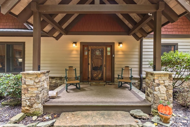 entrance to property featuring a porch