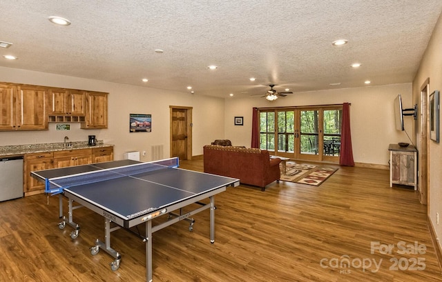 game room with recessed lighting, visible vents, a textured ceiling, and wood finished floors