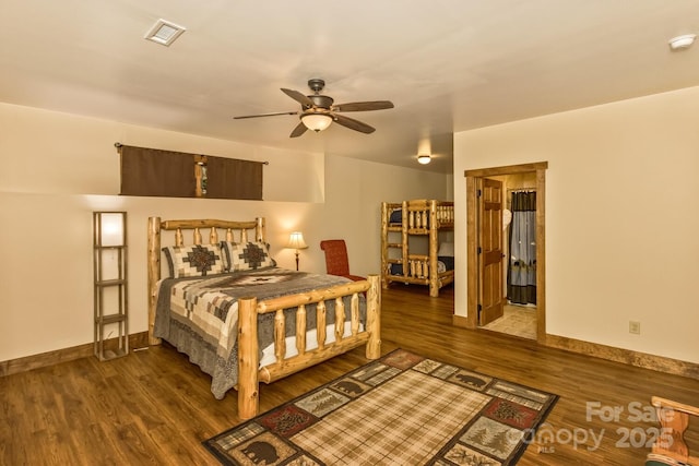 bedroom featuring visible vents, wood finished floors, and baseboards