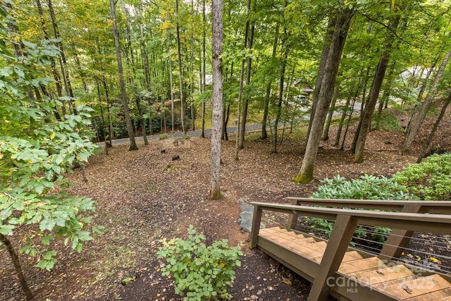 view of yard with a forest view