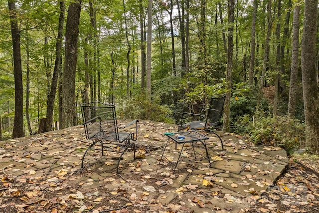 view of landscape featuring a wooded view