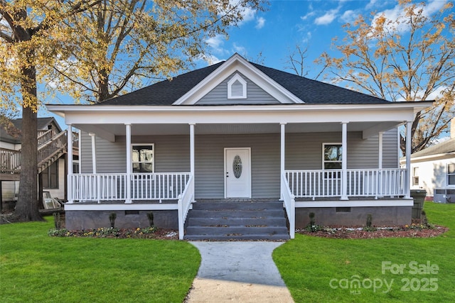 view of front of property featuring crawl space, covered porch, a front yard, and roof with shingles