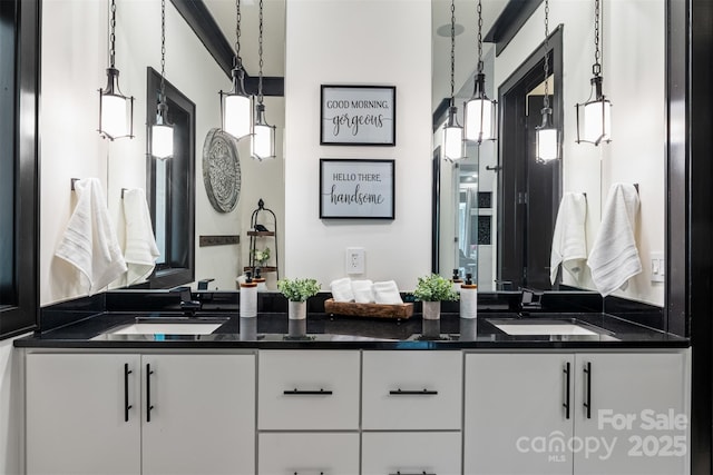 full bathroom featuring double vanity and a sink