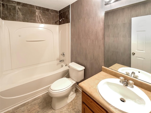 full bathroom featuring vanity, toilet, shower / bathing tub combination, and a textured ceiling