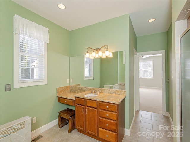 full bathroom featuring tile patterned floors, visible vents, plenty of natural light, and vanity