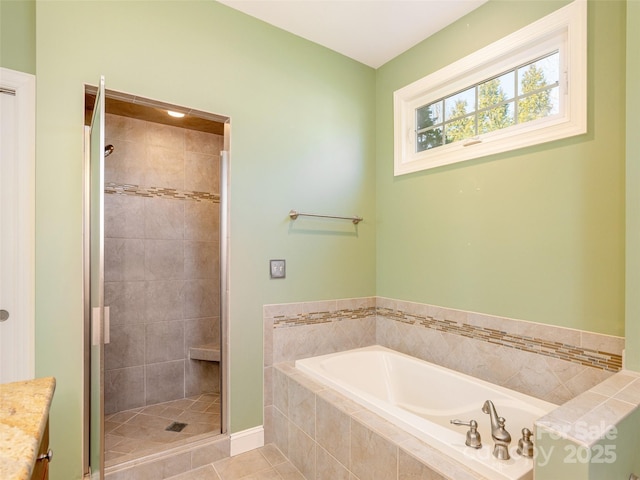 full bath with a bath, a shower stall, and tile patterned floors