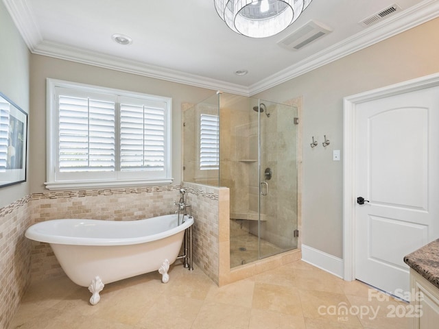 full bathroom with visible vents, a stall shower, tile patterned floors, a soaking tub, and tile walls