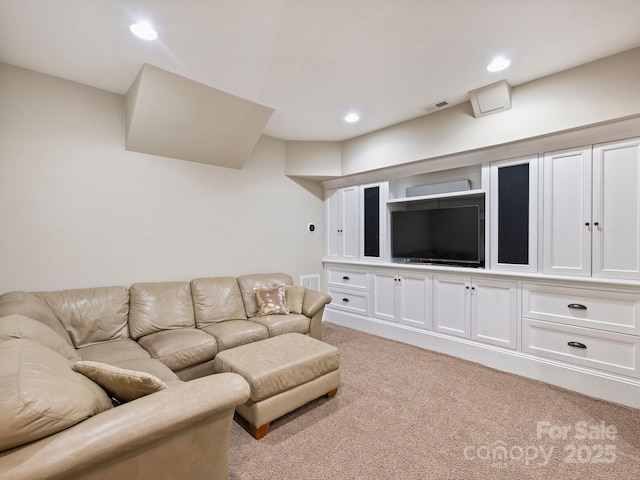 living area featuring recessed lighting, light colored carpet, and visible vents