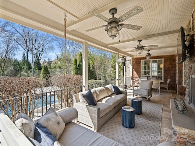 view of patio / terrace with an outdoor living space and ceiling fan