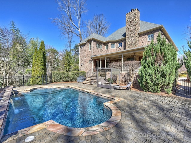 view of pool with a fenced in pool, a fenced backyard, and a patio area