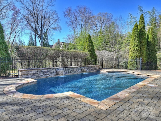 view of pool featuring a fenced in pool, a patio, and fence