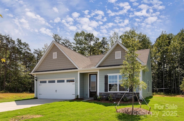 craftsman-style house with stone siding, a front yard, concrete driveway, and an attached garage