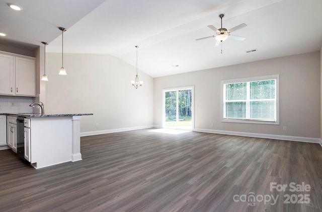 kitchen with vaulted ceiling, visible vents, and open floor plan