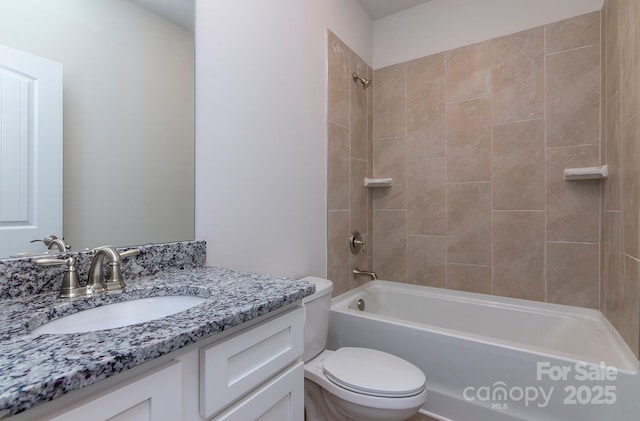 bathroom featuring vanity, toilet, and shower / bathtub combination