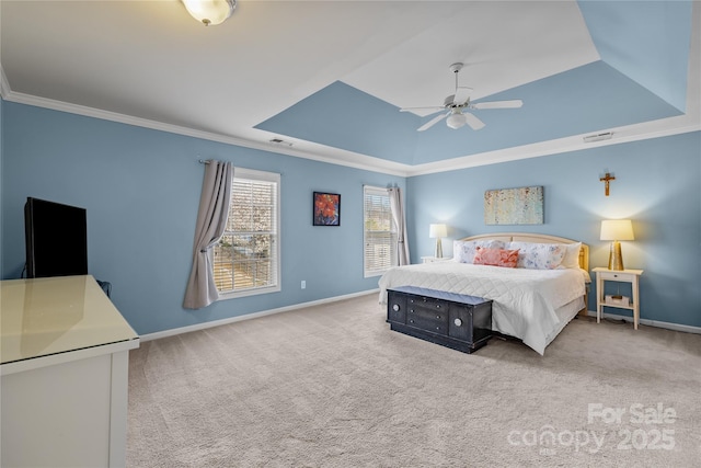 bedroom featuring visible vents, baseboards, a raised ceiling, and carpet