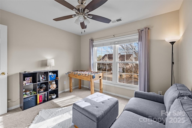 game room featuring visible vents, carpet flooring, a ceiling fan, and baseboards