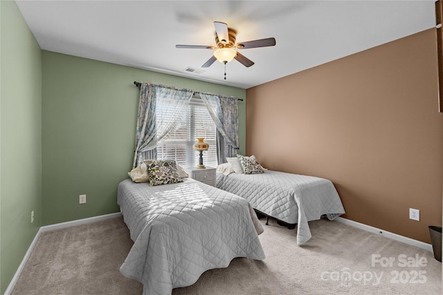 bedroom with light colored carpet, visible vents, and baseboards