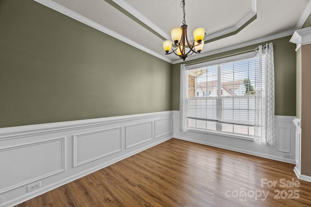 252 Legend Dr, Rock Hill, SC 29732 - spare room with a chandelier, wainscoting, dark wood-type flooring, a tray ceiling, and ornamental molding