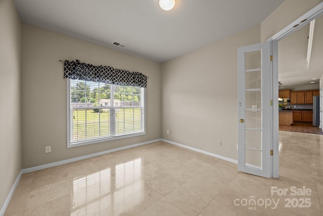 252 Legend Dr, Rock Hill, SC 29732 - spare room with light tile patterned floors, baseboards, and french doors