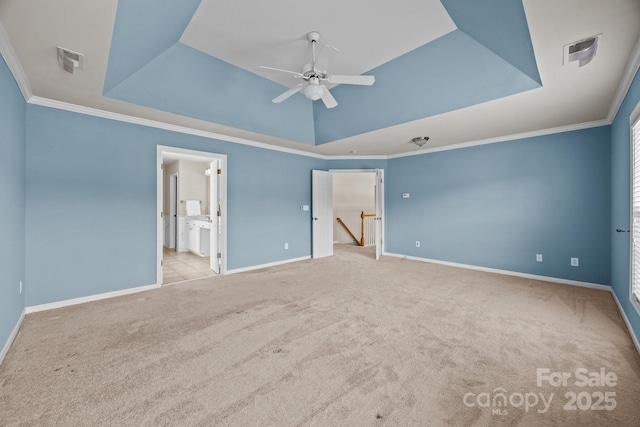 252 Legend Dr, Rock Hill, SC 29732 - unfurnished bedroom featuring a tray ceiling, carpet flooring, baseboards, crown molding, and connected bathroom