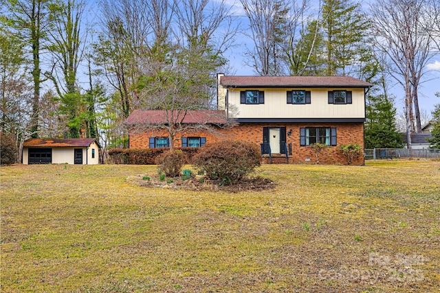 view of front of home with brick siding, an outdoor structure, a front lawn, and fence