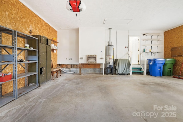 garage with heating unit, a garage door opener, and water heater