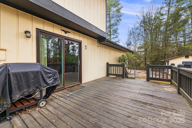 wooden deck with area for grilling