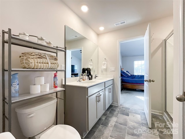 full bathroom featuring a sink, visible vents, toilet, and ensuite bath