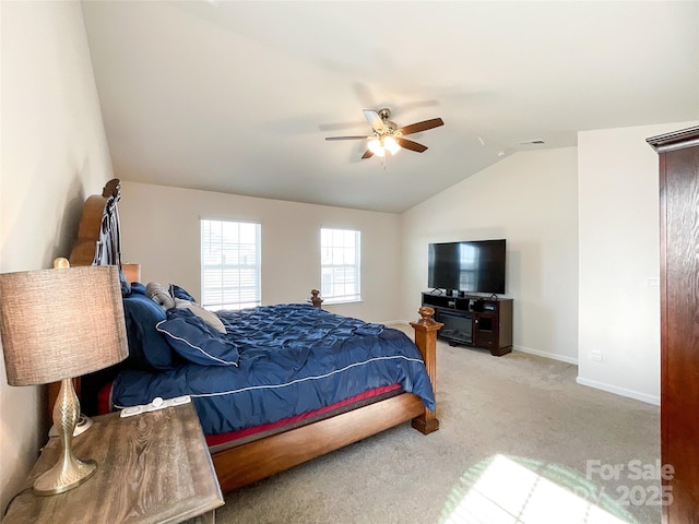 bedroom with lofted ceiling, carpet, baseboards, and ceiling fan