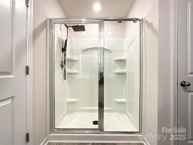 full bath featuring a shower stall