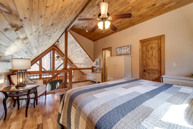 bedroom with wood ceiling, light wood-type flooring, and vaulted ceiling