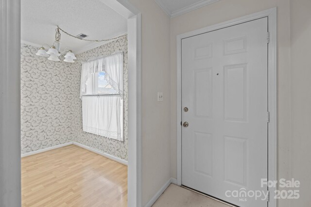 234 Pointe Cir, Rock Hill, SC 29732 - entrance foyer featuring wallpapered walls, crown molding, and wood finished floors