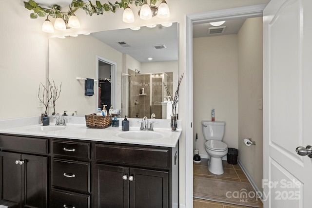 full bathroom featuring a stall shower, visible vents, and a sink