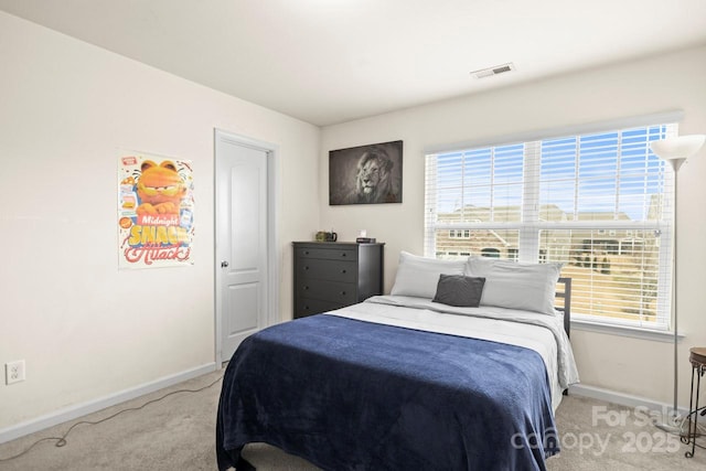 bedroom featuring visible vents, baseboards, and carpet flooring