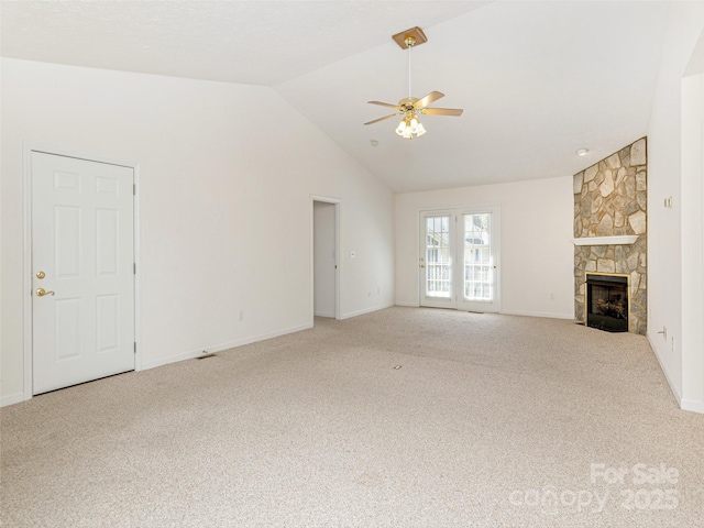 unfurnished living room featuring a fireplace, high vaulted ceiling, ceiling fan, and carpet floors