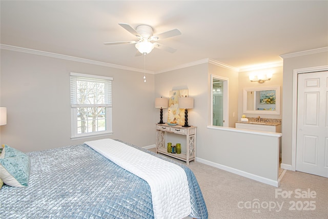 bedroom with crown molding, baseboards, light colored carpet, a ceiling fan, and a sink