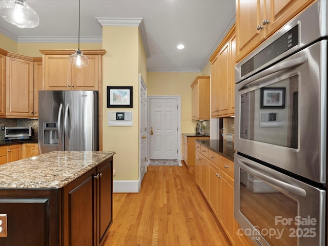 kitchen with ornamental molding, light wood-style flooring, tasteful backsplash, stainless steel appliances, and light stone countertops