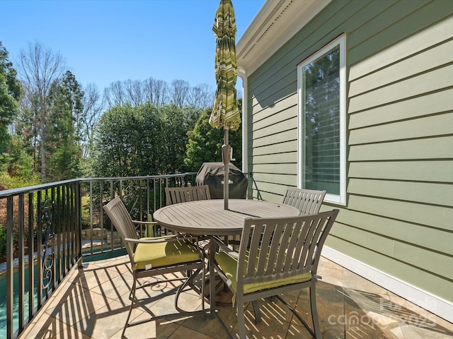 balcony featuring outdoor dining space