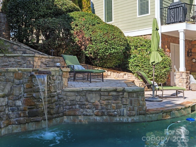 view of patio / terrace featuring a balcony