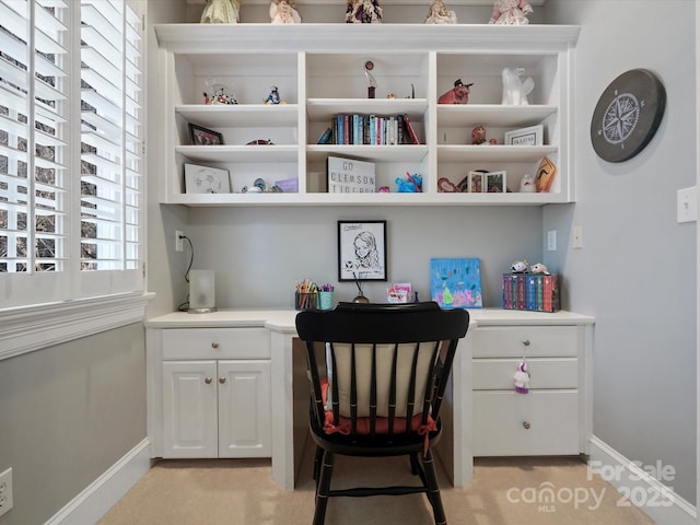 interior space featuring baseboards