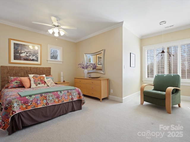 carpeted bedroom featuring ceiling fan, visible vents, baseboards, and ornamental molding