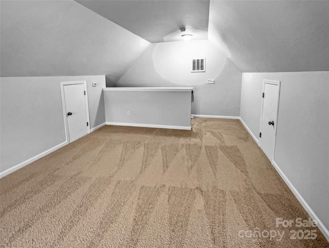 bonus room featuring vaulted ceiling, baseboards, and visible vents