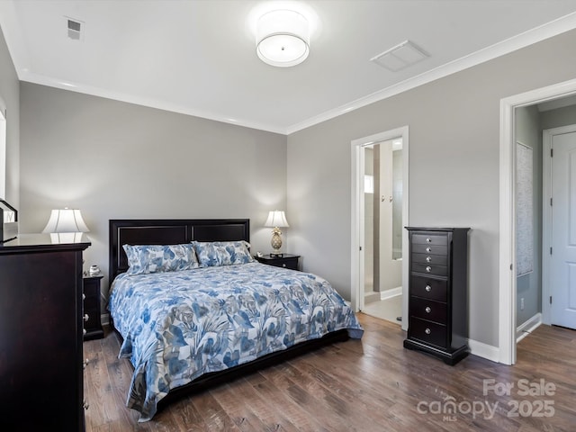 bedroom with visible vents, ornamental molding, and wood finished floors