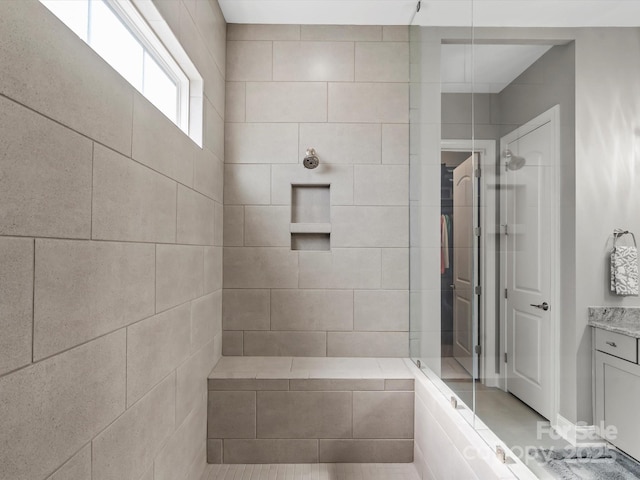 full bathroom with walk in shower and vanity