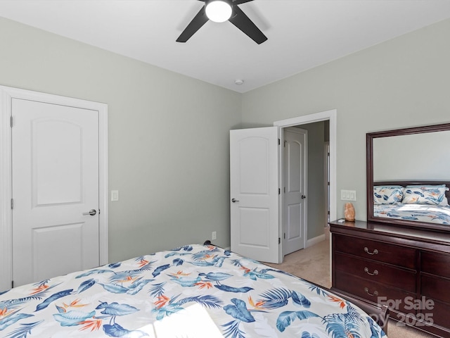 bedroom featuring light colored carpet and ceiling fan