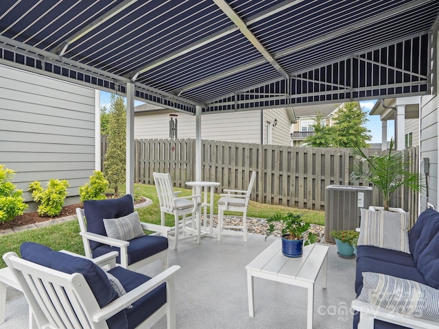 view of patio with central AC unit, outdoor lounge area, and fence