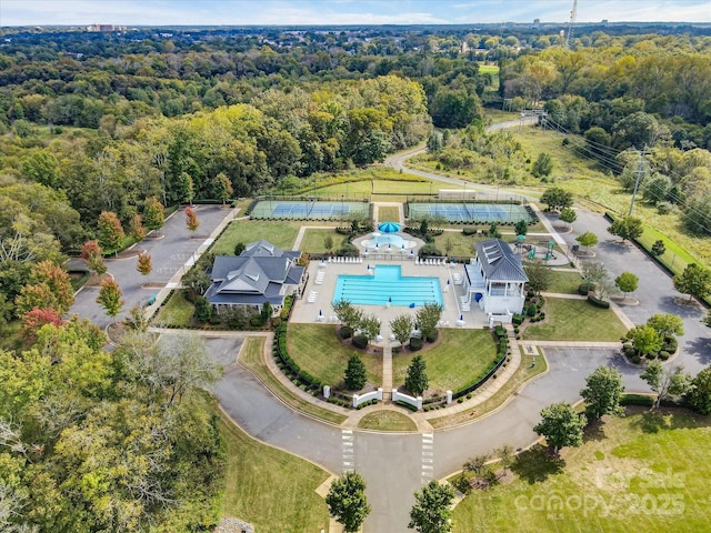 aerial view featuring a wooded view