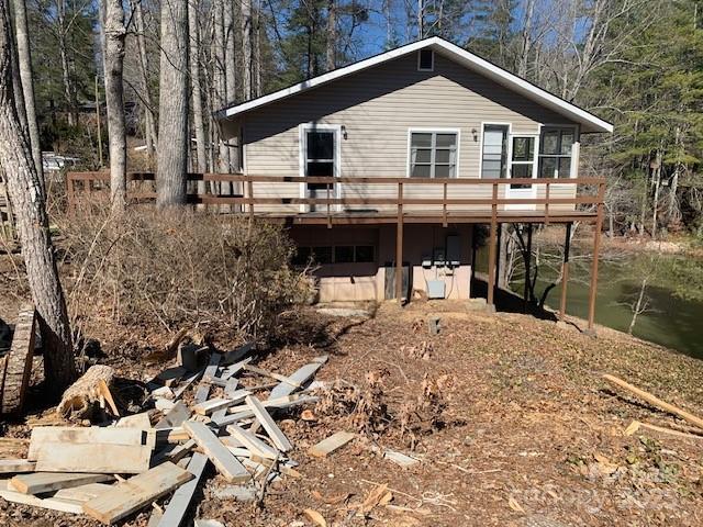 rear view of house featuring a deck