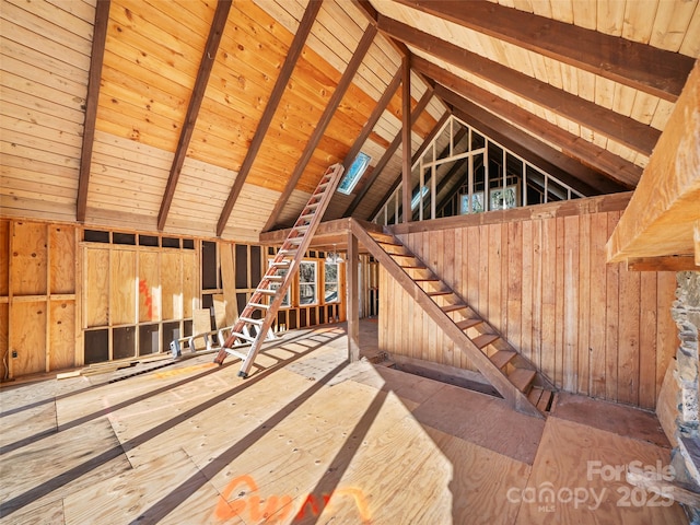 unfinished attic with an upstairs landing