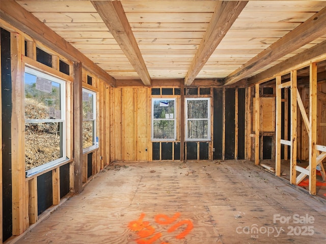 miscellaneous room featuring beam ceiling